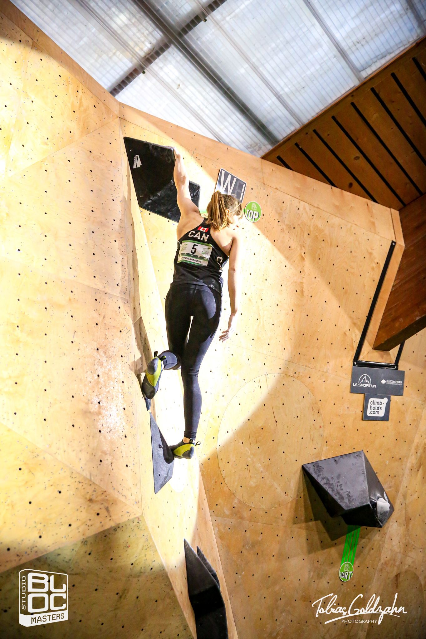 Madison Fischer at the top of her first boulder in finals of Studio Bloc Masters 2023 in Germany