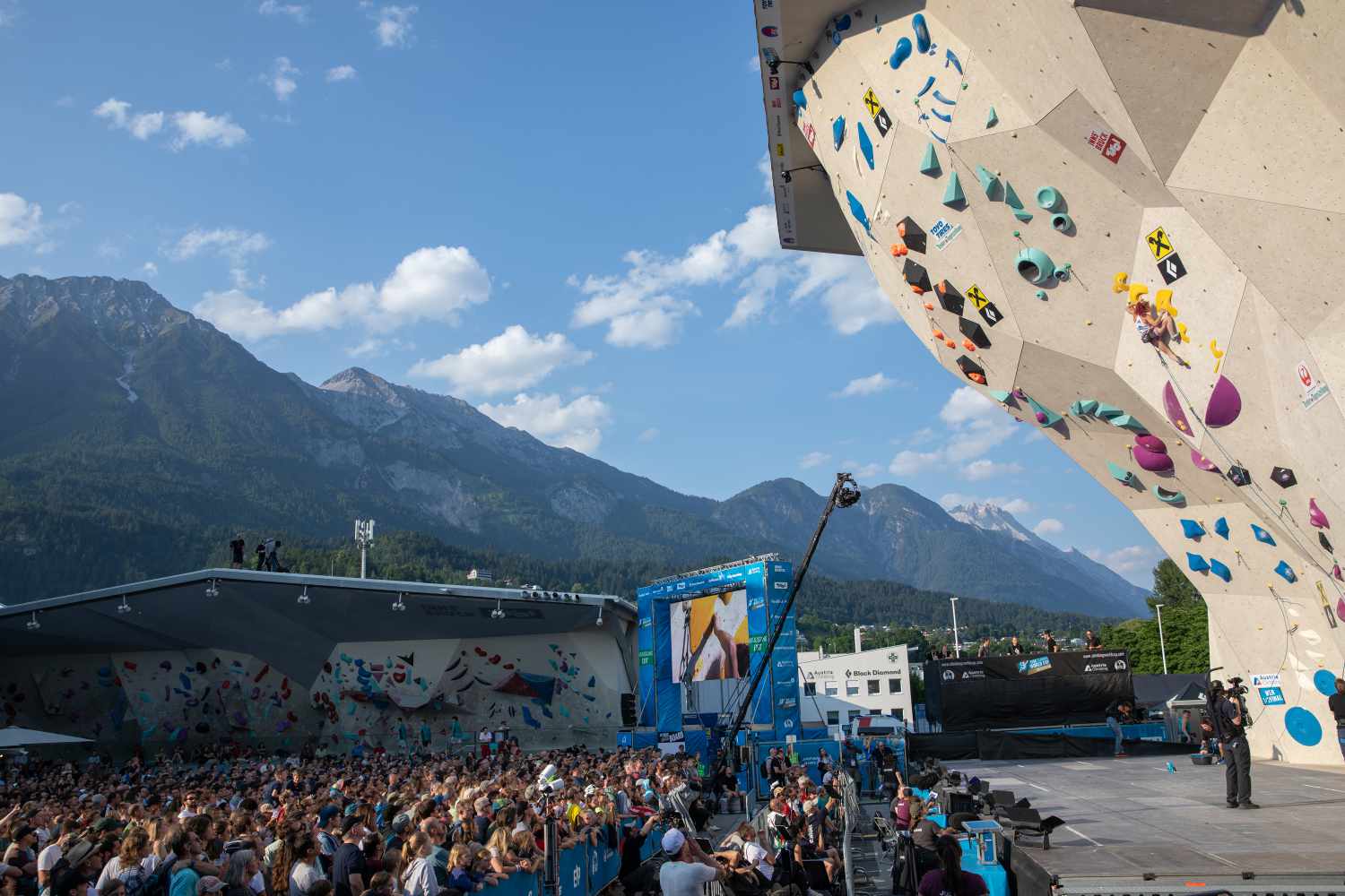 2023 Innsbruck World Cup Semi Final Round with mountains in the background by Tobias Haller IFSC